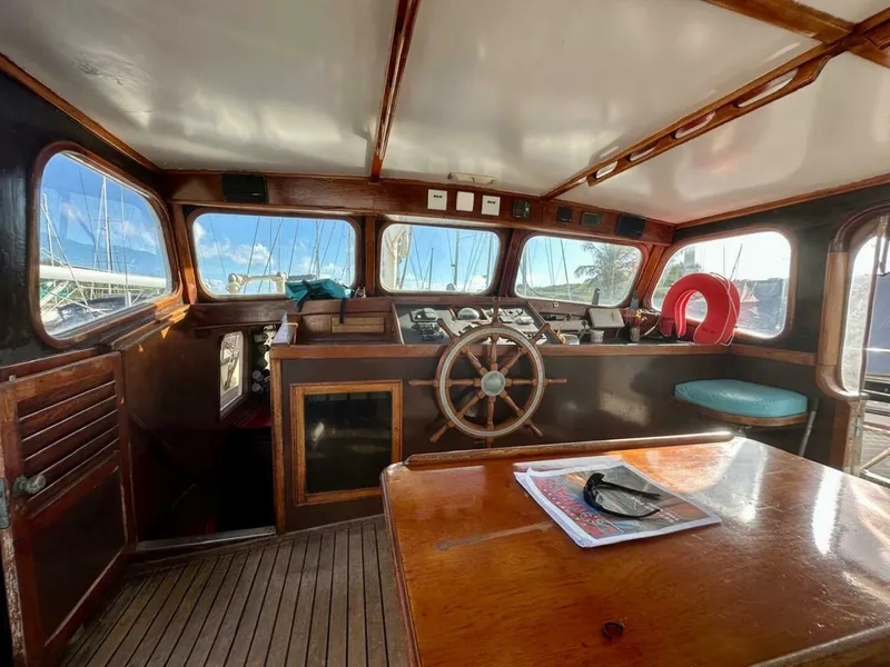 Slide: The Image of 72 ft Custom 1978 Don Brooke Ketch/Motorsailer MONSOON Monsoon is a 1978 large ocean-going cruising ketch that was professionally designed and built and is well equipped for the most demanding of open ocean voyages and has made three Pacific Ocean crossings.  

She carries all furling sails, a 185 horsepower  - 4863267