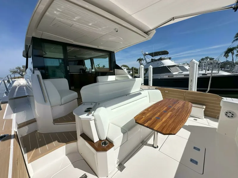 Slide: The Image of 2025 Tiara Yachts 60 EX - Aft Facing Lounge - 6092088