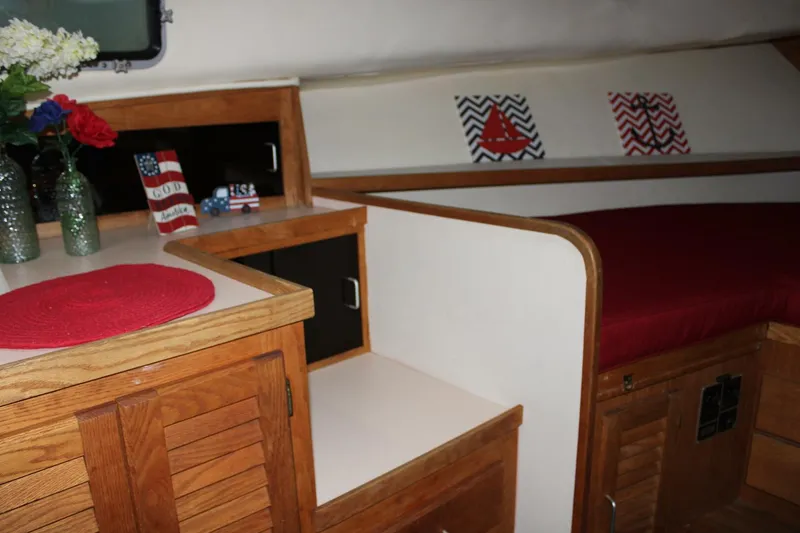 Slide: The Image of Mainship 40 - Forward cabin sitting area with lots of storage - 5018472