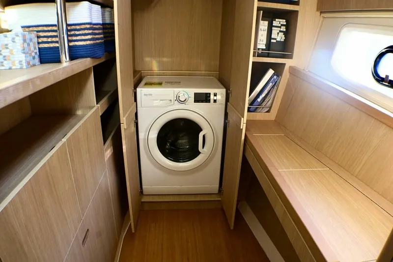 Slide: The Image of 2018 Aquila 44 Catamaran- Master Stateroom/ laundry - 5681303
