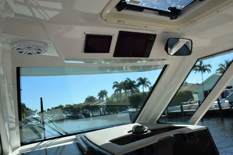 Slide: The Image of Hardtop Has Integral Stereo, Lighting, Vent Hatch, Engine And SeaKeeper Screens Above - 5367503