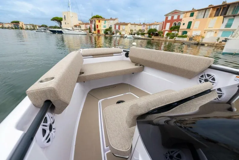 Slide: The Image of Axopar 22 T-Top Helm and Instrument Panel Close-up view of the helm and instrument panel aboard the Axopar 22 T-Top, highlighting the intuitive layout, modern electronics, and sleek Nordic styling. Photo by East Coast Yacht Sales in Casco Bay, Maine. - 5715203