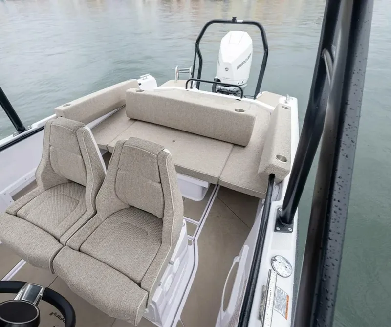 Slide: The Image of Axopar 22 T-Top Helm Close-up view of the helm aboard the Axopar 22 T-Top, highlighting the intuitive layout and sleek Nordic styling. Photo by East Coast Yacht Sales in Casco Bay, Maine. - 5715204