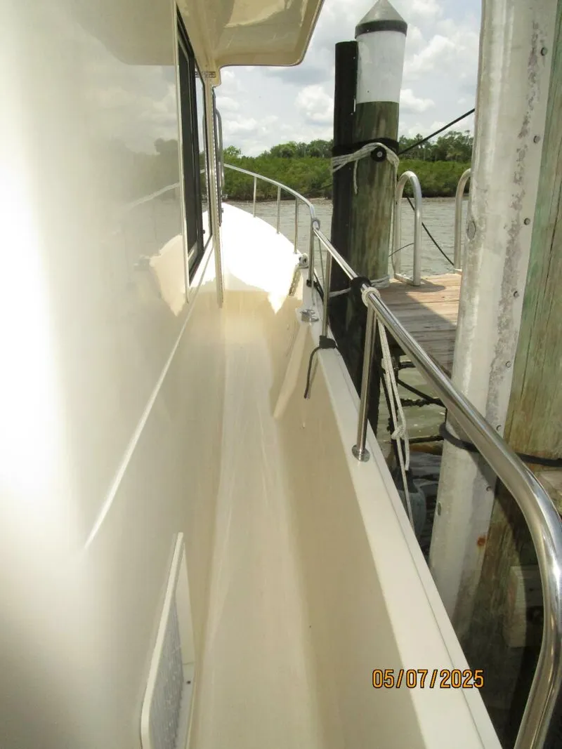 Slide: The Image of 34' Mainship starboard side deck2 - 5297683