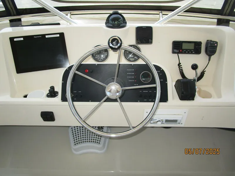 Slide: The Image of 34' Mainship flybridge helm2 - 5297599