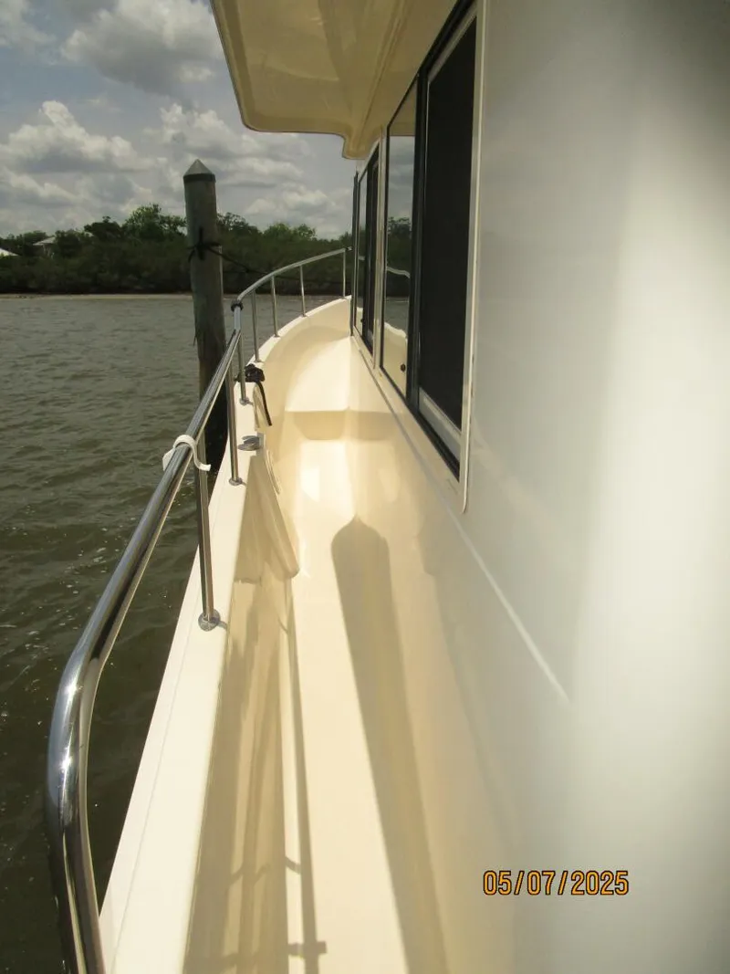 Slide: The Image of 34' Mainship port side deck2 - 5297671