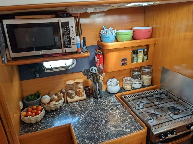 Slide: The Image of 2002 Lagoon 470 Owner Version For Sale Galley Outboard - 5305533