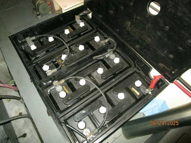 Slide: The Image of 63' Hateras port engine room battery bank - 5444747