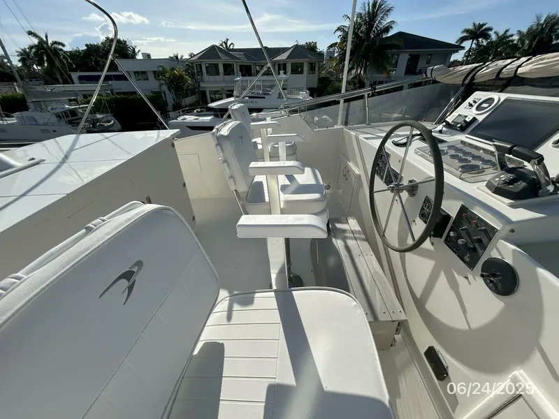 Slide: The Image of 63' Hatteras flybridge port forward - 5444697