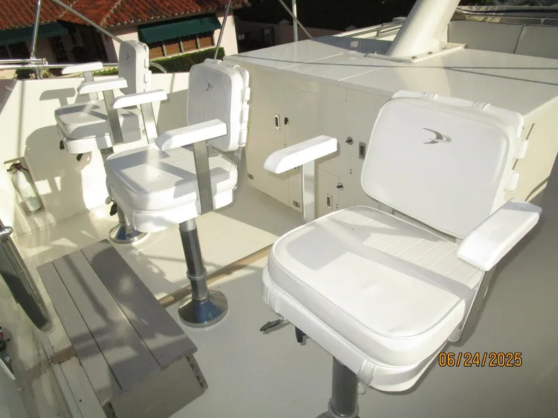 Slide: The Image of 63' Hatteras flybridge helmseats - 5444693