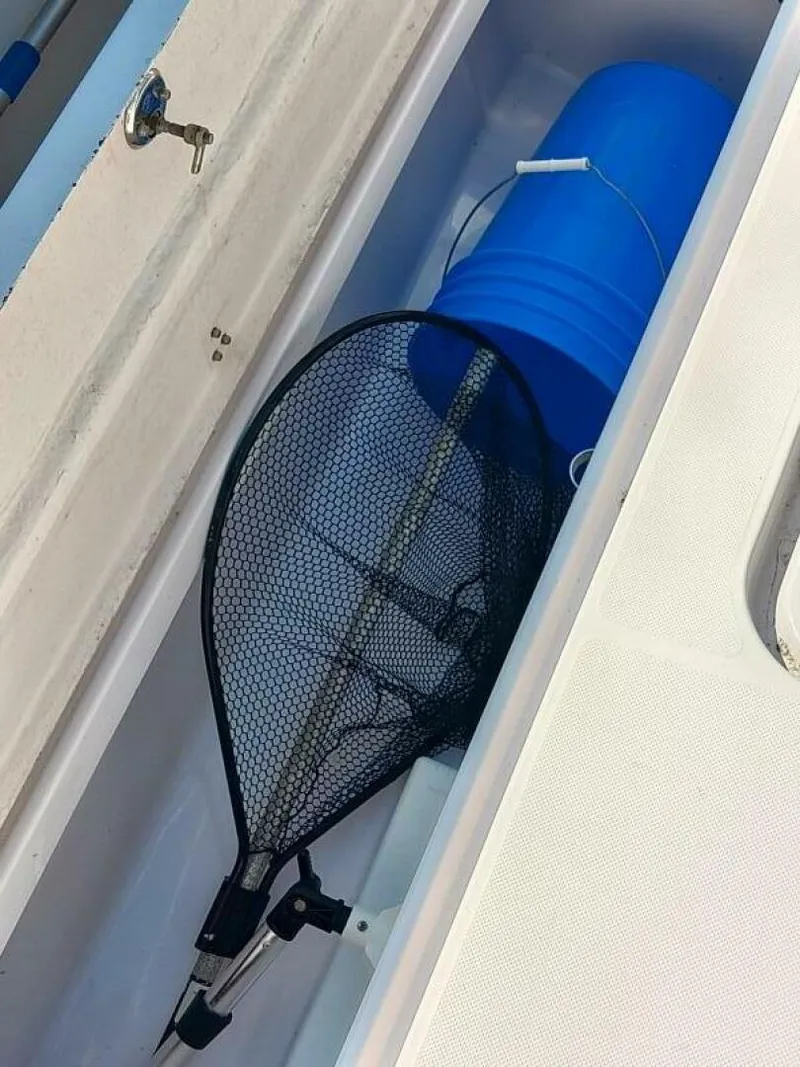 Slide: The Image of Pro-Line 32 Express Starboard gunwale storage hatch view in aft cockpit. - 5533916