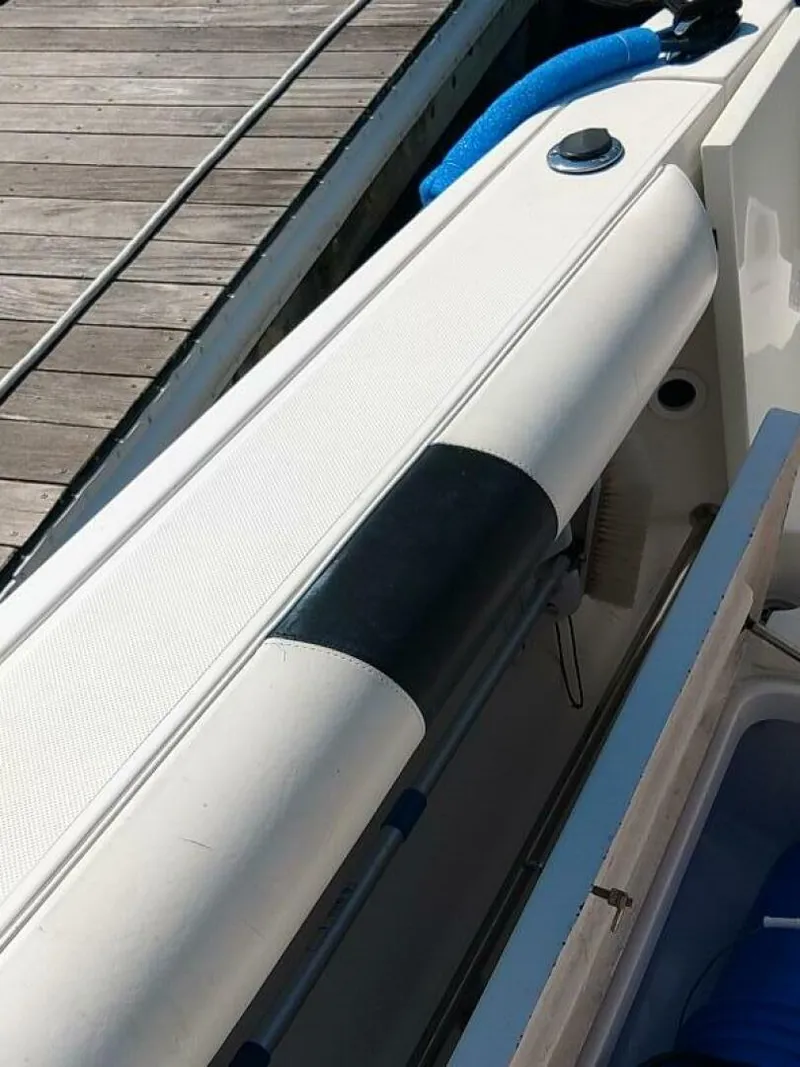 Slide: The Image of Pro-Line 32 Express Port side storage hatch in aft cockpit. - 5533917