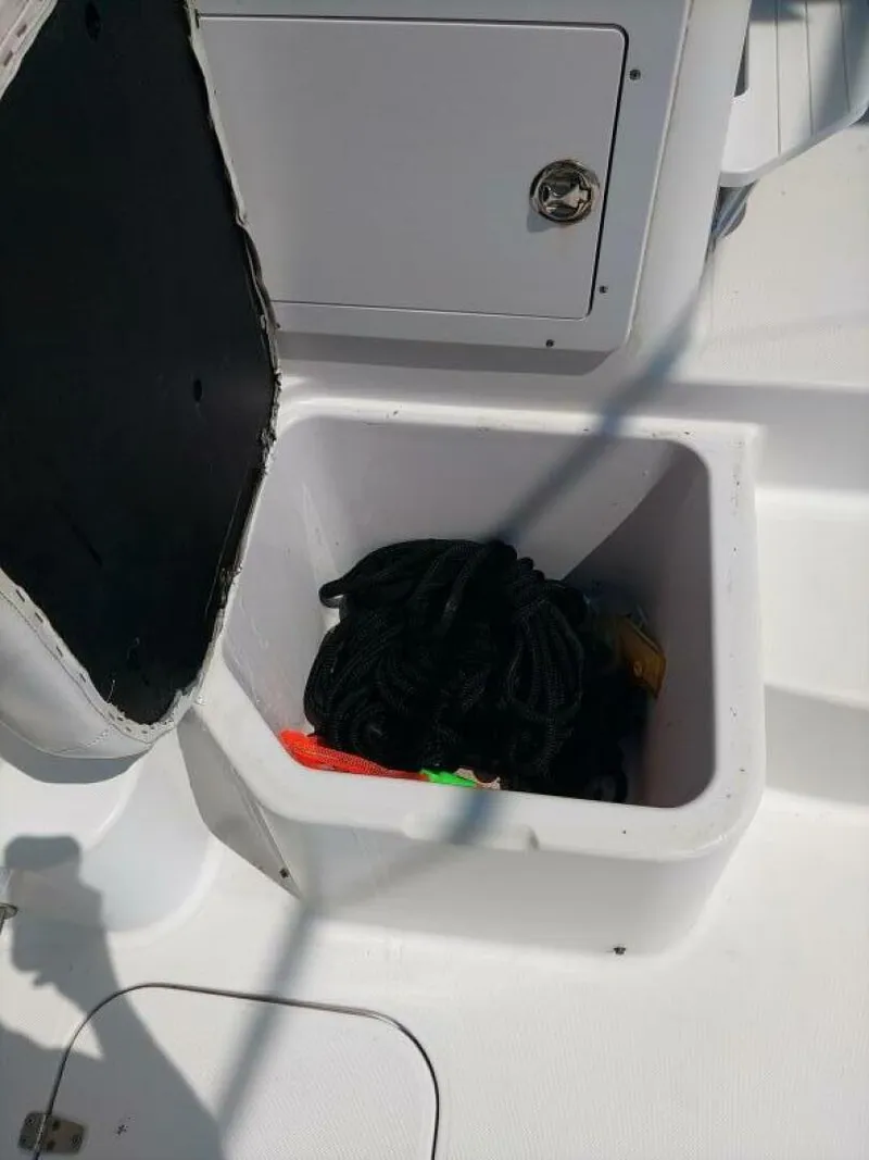 Slide: The Image of Pro-Line 32 Express Starboard behind helm seat storage. - 5533922