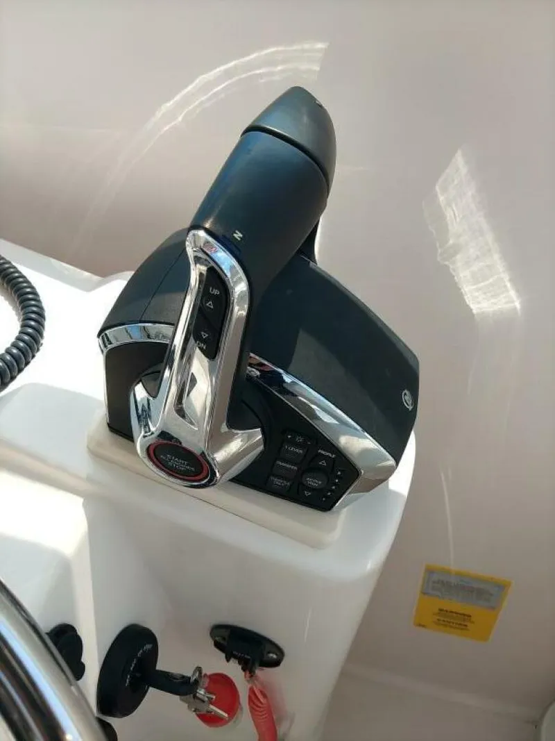 Slide: The Image of Pro Line 32 Express Engine Controls View of DTC Controls with ActiveTrim for Mercury Verado Outboards as viewed from inside helm area - 5490468