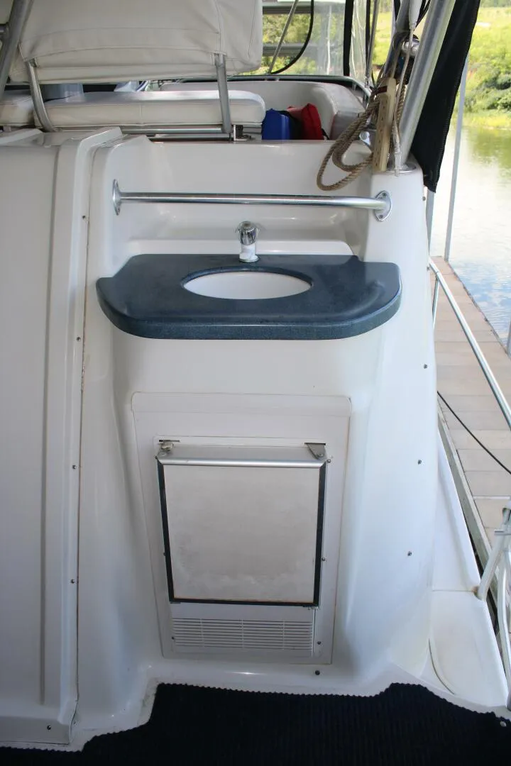 Slide: The Image of 34 ft Mainship - Aft Deck Sink and Ice Maker - 5490458