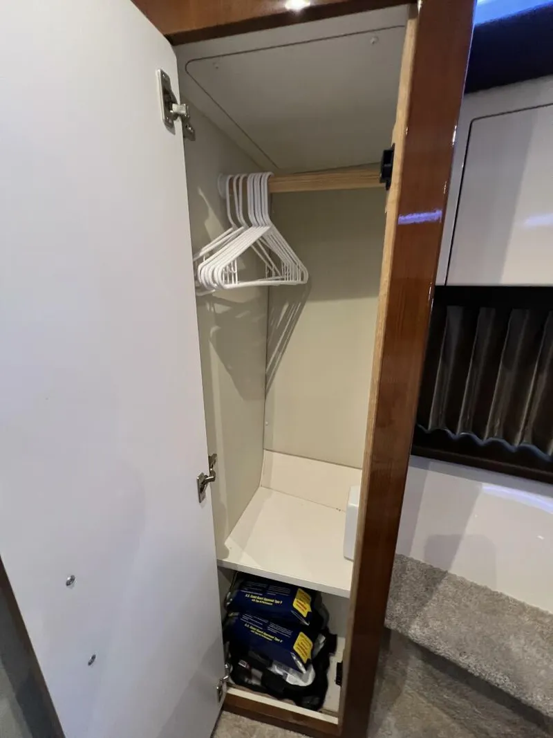 Slide: The Image of 2016 Carver C34 Aft Stateroom Closet - 5495210