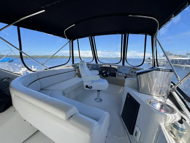 Slide: The Image of 2006 Carver 444 Cockpit Motor Yacht - Helm Seating - 5511838