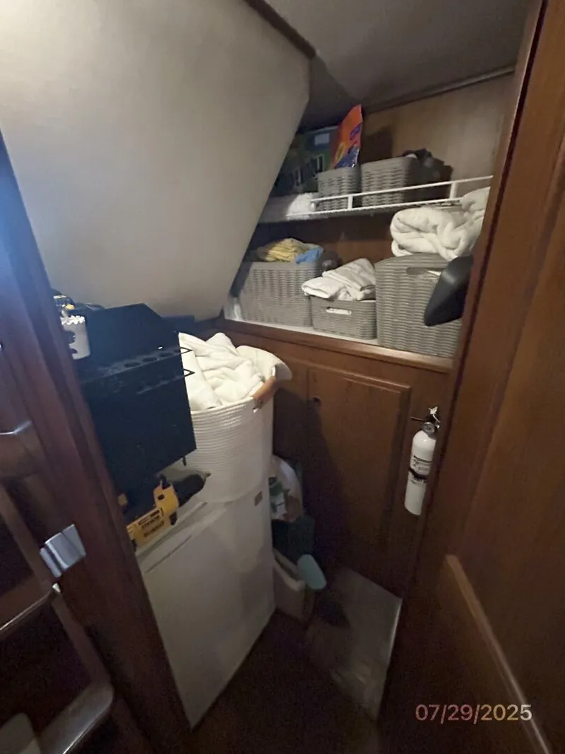 Slide: The Image of 44' DeFever master stateroom walk-in closet - 5527252