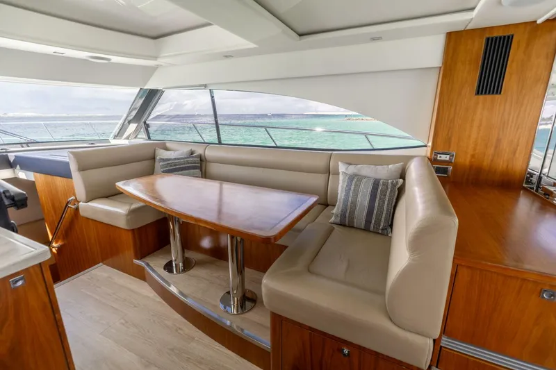 Slide: The Image of 2018 Riviera 4800 Sport Yacht- Runaway Island- Dinette - 5539051