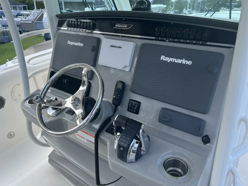 Slide: The Image of 2014 Boston Whaler 350 Outrage Helm from Starboard with all Electronics Covers on - 5576103