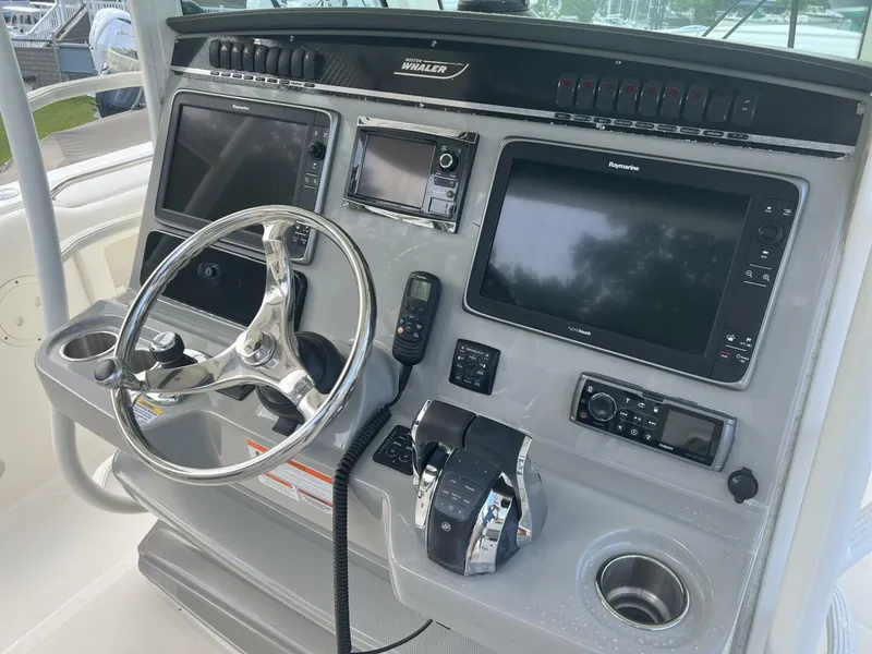 Slide: The Image of 2014 Boston Whaler 350 Outrage Helm from Starboard with electronics uncovered - 5576105