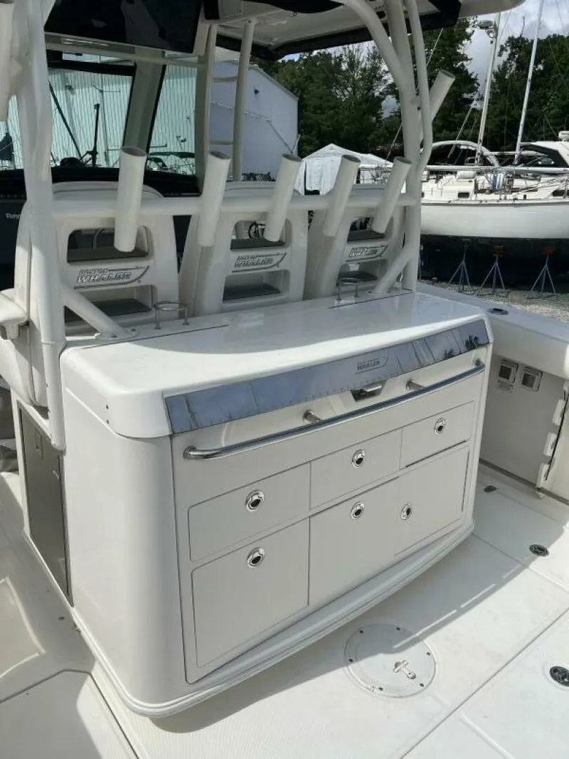 Slide: The Image of 2014 Boston Whaler 350 Outrage Summer Kitchen Leaning Post closed, looking from port side - 5576108
