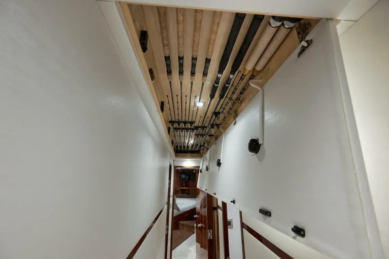 Slide: The Image of 2025 Viking 90 Convertible- NIKKI BELLA- Companionway Overhead Rod Storage - 5592576