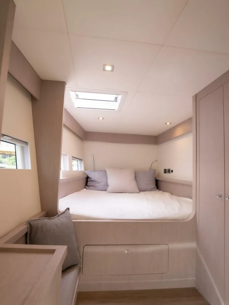 Slide: The Image of Alva OE 54 Port Forward Cabin Bed Ocean Eco 54 port forward cabin with raised double berth and windows - 5603818