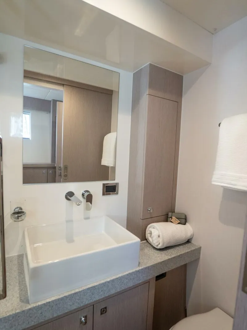 Slide: The Image of Alva OE 54 Port Forward Ensuite Ocean Eco 54 port forward cabin ensuite bathroom with vanity and walk-in shower - 5603820