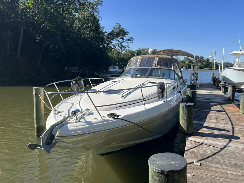 The Image of 2002 Sea Ray 360 Sundancer docked in a serene marina setting. - 5645761
