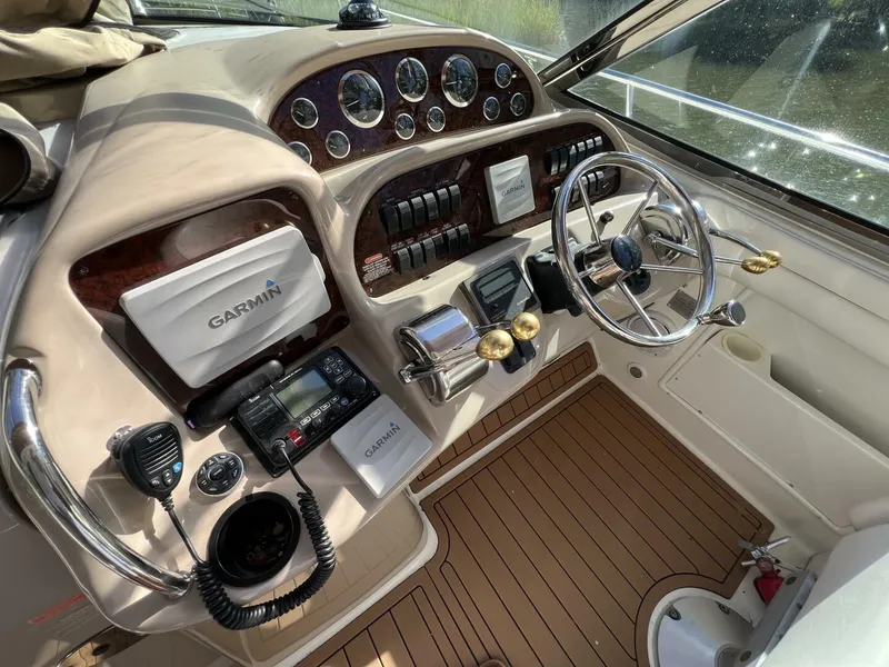 Slide: The Image of 2002 Sea Ray 360 Sundancer Helm with Electronics Covers on - 5645772