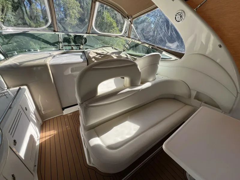 Slide: The Image of 2002 Sea Ray 360 Sundancer aft seating looking forward toward helm - 5645767