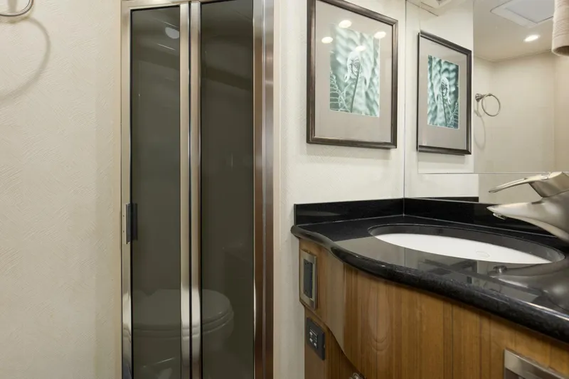 Slide: The Image of 2007 64 Viking Enclosed Bridge Reel Blues Rear Starboard Stateroom Head - 5641873