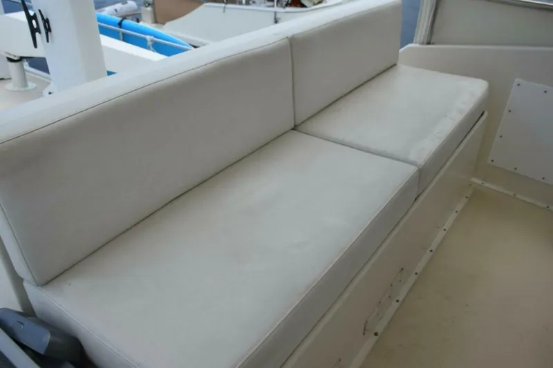 Slide: The Image of Helm Deck aft companion bench seat with white vinyl cushions - 5711476