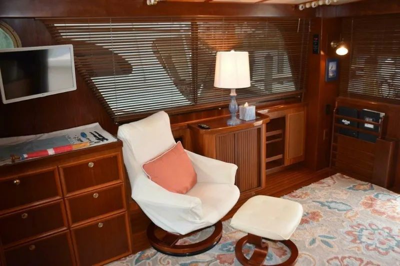 Slide: The Image of Lounge chair with ottoman between desk area and AV cabinet - 5711483