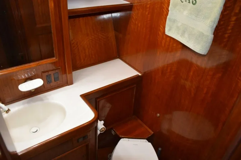 Slide: The Image of Guest head also has second door from companionway. Molded vanity top and new freshwater head - 5711519