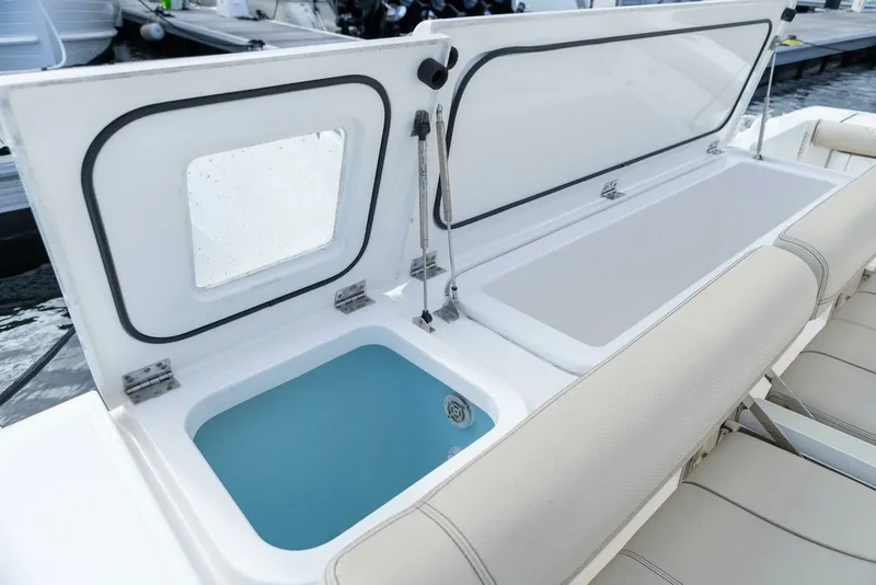 Slide: The Image of Pursuit 38 - TRACKER - Cockpit Storage 2018 Pursuit 38 Center Console TRACKER - 7680294
