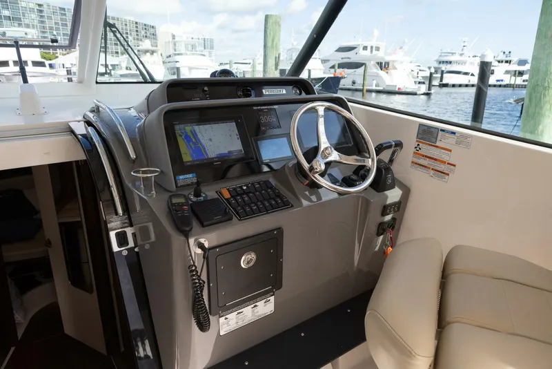Slide: The Image of Pursuit 38 - TRACKER - Helm Station 2018 Pursuit 38 Center Console TRACKER - 5725392
