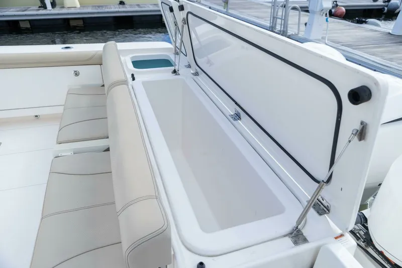 Slide: The Image of Pursuit 38 - TRACKER - Cockpit Storage 2018 Pursuit 38 Center Console TRACKER - 7680293