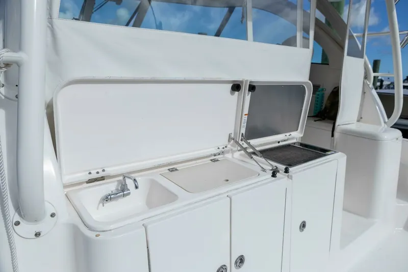 Slide: The Image of Pursuit 38 - TRACKER - Cockpit Storage 2018 Pursuit 38 Center Console TRACKER - 7680291
