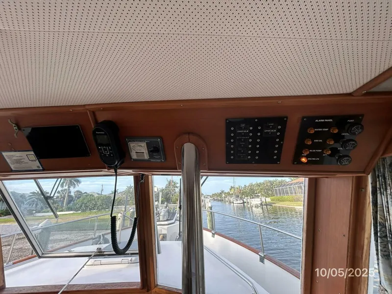 Slide: The Image of 42' Grand Banks lower helm overhead electronics - 5726293