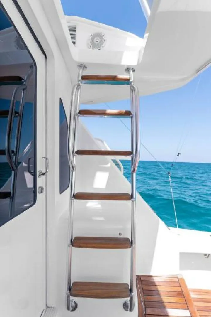 Slide: The Image of 2021 Viking 54 Convertible HAMMERHEADS Stairs to Flybridge - 5755714
