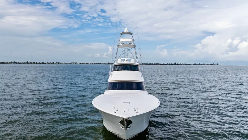 Slide: The Image of Forward View of Viking 72 Bow This image showcases the sleek bow of the 2021 Viking 72 Enclosed Bridge, emphasizing its streamlined design and robust construction. The expansive deck space is perfect for both functionality and leisure, while the towering flybridge offers commanding vi - 7377954