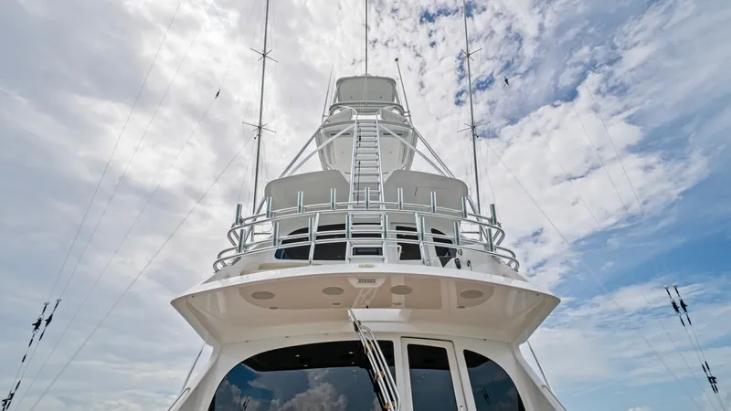 Slide: The Image of Tower and Bridge View This image showcases the impressive tower and enclosed bridge of the 2021 Viking 72 Enclosed Bridge. The structure is designed for optimal visibility and functionality, with sleek lines and robust materials. The skyward view highlights the vessel's advanc - 7377941