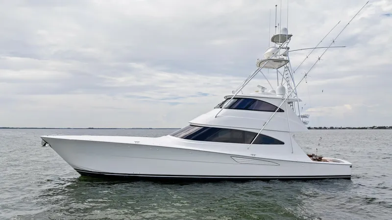 Slide: The Image of Side Profile of Viking 72 Enclosed Bridge The sleek side profile of the 2021 Viking 72 Enclosed Bridge showcases its elegant design and superior craftsmanship. The yacht's streamlined hull and enclosed flybridge offer a modern silhouette, providing both style and functionality. This vessel is ide - 7377956