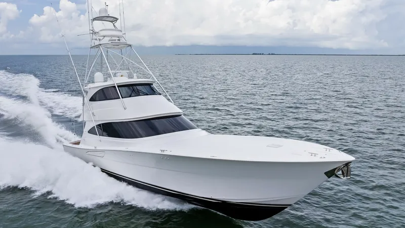 The Image of Dynamic Bow View at Sea The 2021 Viking 72 Enclosed Bridge glides effortlessly across the open water, showcasing its sleek and powerful bow design. This vessel, offered by Galati Yacht Sales, features a striking enclosed bridge that enhances both style and functionality. The smo - 7377873