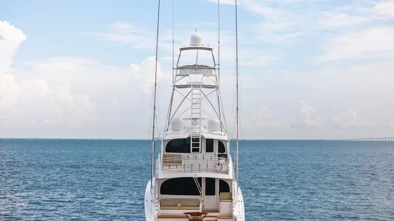 Slide: The Image of Aft View with Tower and Cockpit This aft view of the 2021 Viking 72 Enclosed Bridge showcases its impressive tower, ideal for sport fishing and navigation. The spacious cockpit is designed with comfort in mind, featuring plush seating and ample space for relaxation. This vessel combines - 7377959