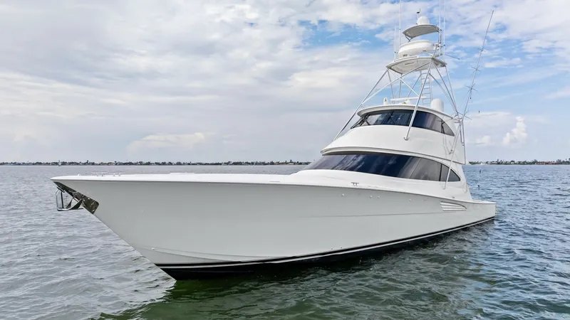 Slide: The Image of Bow View of Viking 72 Enclosed Bridge This striking image showcases the sleek and powerful bow of the 2021 Viking 72 Enclosed Bridge. The vessel's aerodynamic profile and towering enclosed bridge reflect Viking's signature craftsmanship and performance. Its sharp lines and expansive windows p - 7377955
