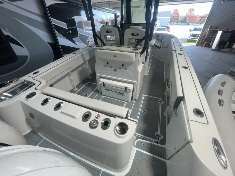 Slide: The Image of Stingray Center Console Deck Layout – Spacious Aft Cockpit Interior deck photo showing the open layout, rod holders, non-skid flooring, and aft seating—showcasing the fishing-ready design of the Stingray center console. - 5799742