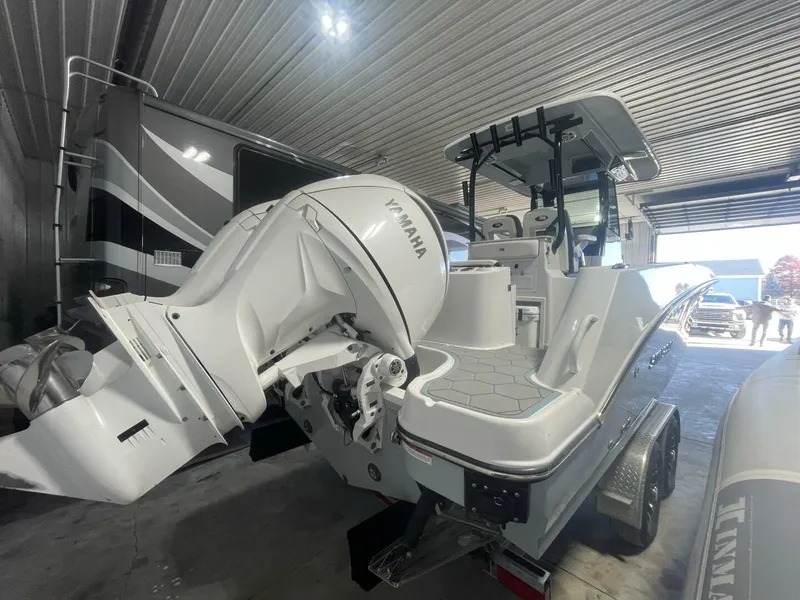 Slide: The Image of Yamaha Outboards and Swim Platform – Stingray Center Console Angled rear shot displaying the Yamaha engines, swim platforms, and clean deck lines of a Stingray center console—perfect for marine sales promotions. - 5799743